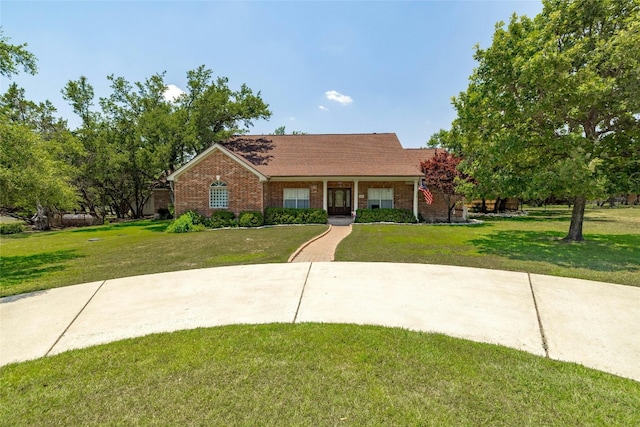 single story home featuring a front yard