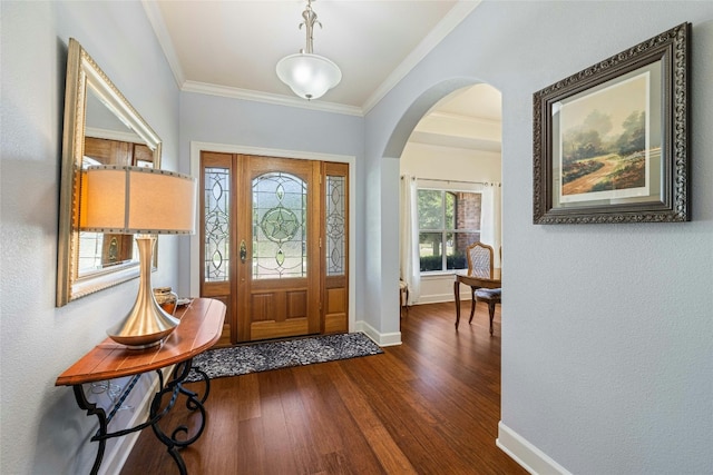 entryway with dark hardwood / wood-style floors and ornamental molding