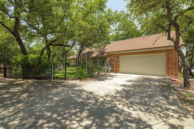 ranch-style home featuring a garage