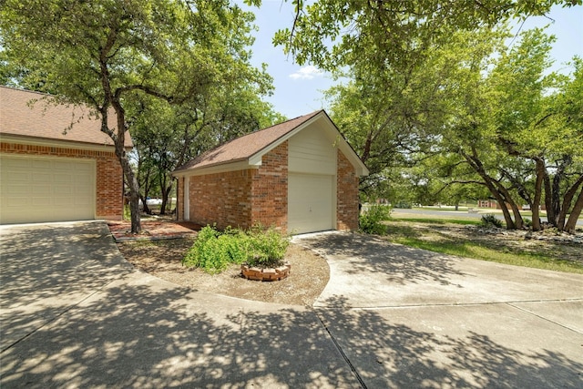 view of side of home featuring a garage