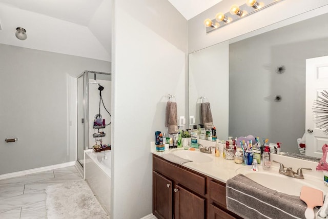 bathroom with vanity and shower with separate bathtub