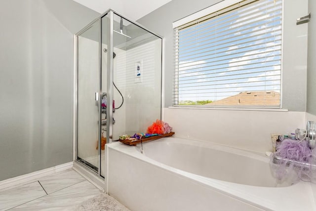 bathroom with separate shower and tub