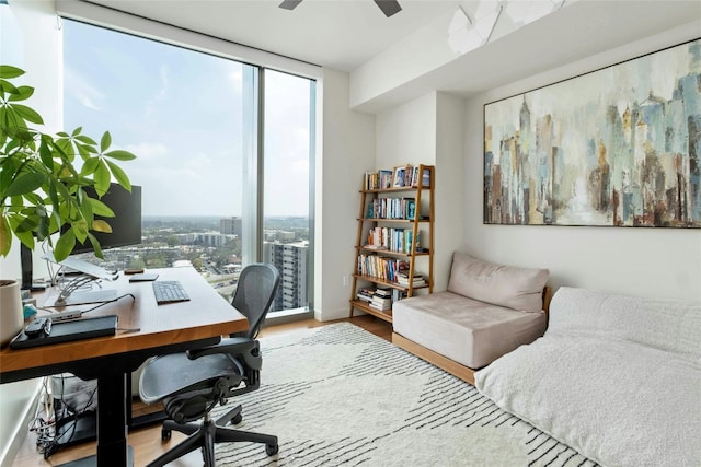 44 E Ave Unit 1507, Austin, TX 78701 - office featuring plenty of natural light, floor to ceiling windows, wood finished floors, and ceiling fan