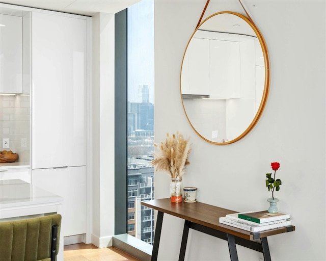 44 E Ave Unit 1507, Austin, TX 78701 - detailed view of tasteful backsplash and wood finished floors