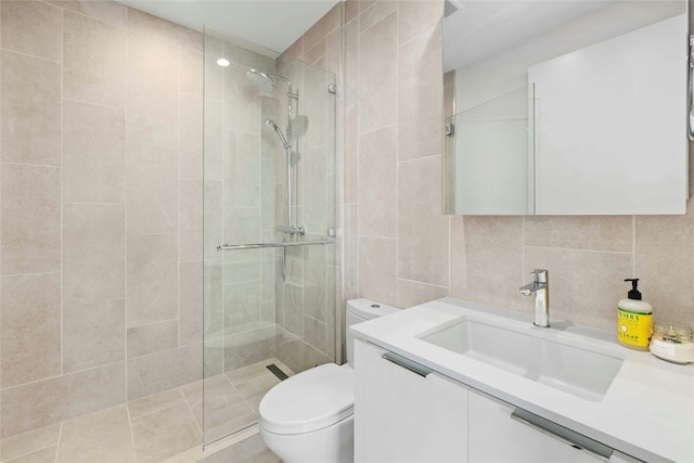 44 E Ave Unit 1507, Austin, TX 78701 - bathroom featuring toilet, a tile shower, tile walls, vanity, and decorative backsplash