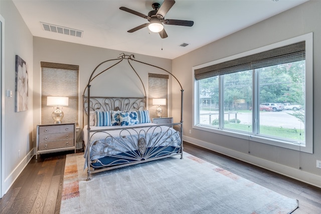 bedroom with ceiling fan and hardwood / wood-style floors