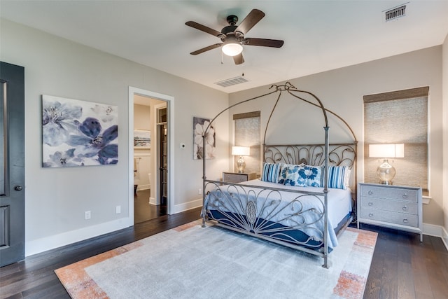 bedroom featuring ensuite bathroom, dark hardwood / wood-style floors, and ceiling fan