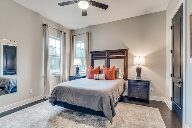 bedroom featuring dark hardwood / wood-style flooring and ceiling fan