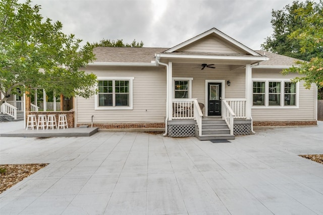 view of front facade featuring covered porch, a patio, and ceiling fan