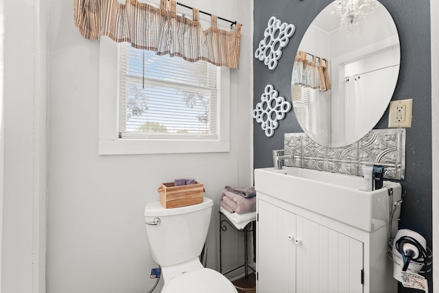 bathroom with toilet and vanity