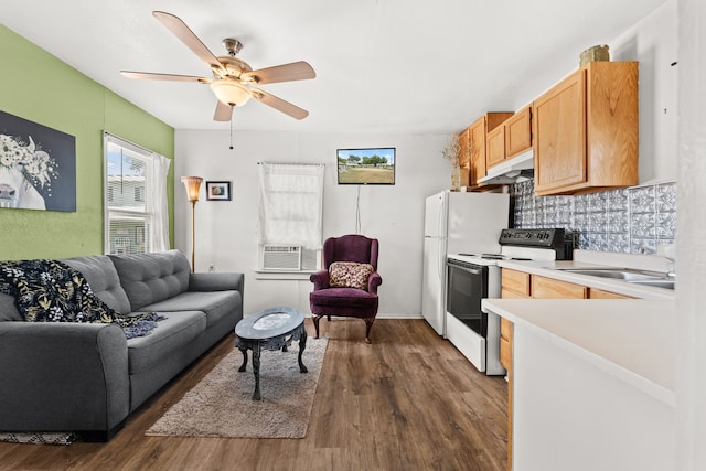 living room featuring sink, ceiling fan, cooling unit, and dark hardwood / wood-style flooring