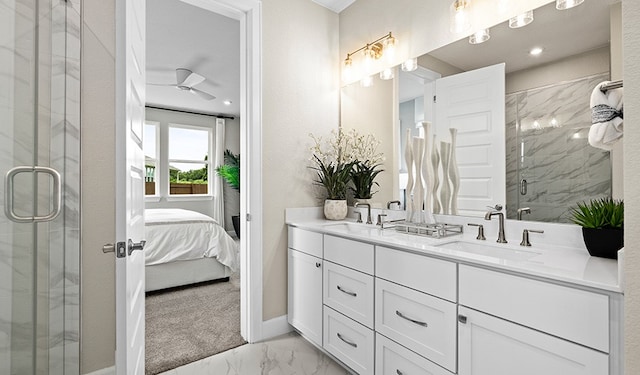 bathroom with ceiling fan, a shower with door, and vanity