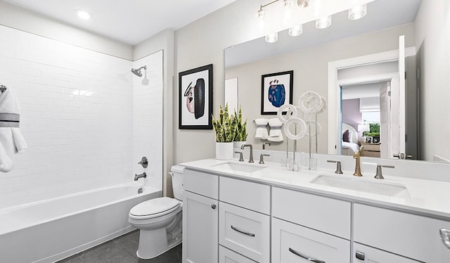 full bathroom with vanity, tile patterned floors, tiled shower / bath combo, and toilet