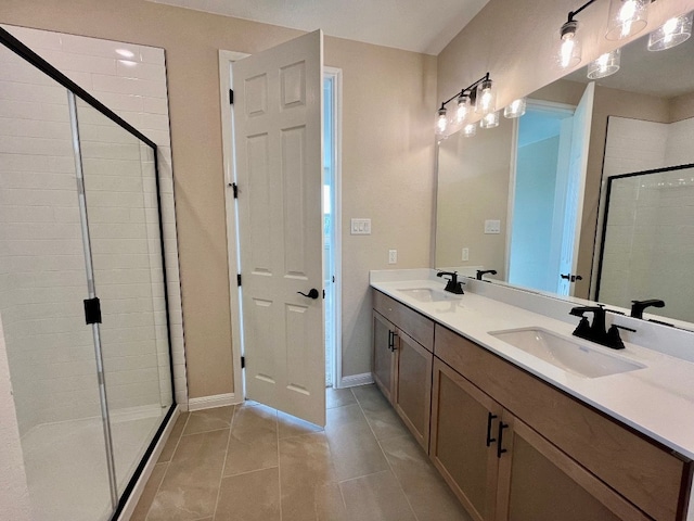 bathroom with vanity, tile patterned floors, and a shower with shower door