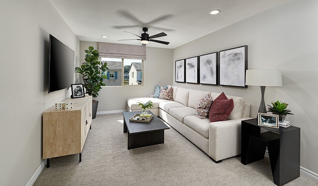 carpeted living room featuring ceiling fan