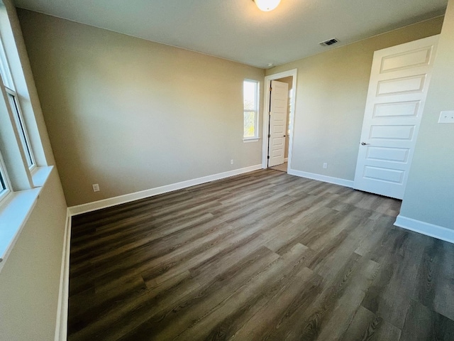 201 Alistair Dr, Georgetown, TX 78633 - unfurnished bedroom with dark wood-style floors and baseboards