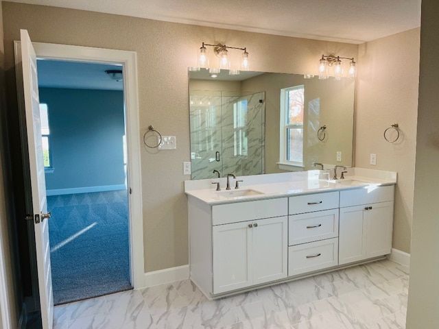 201 Alistair Dr, Georgetown, TX 78633 - full bath featuring a marble finish shower, marble finish flooring, double vanity, and baseboards