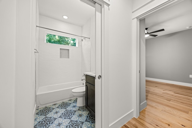 full bathroom featuring toilet, ceiling fan, shower / tub combination, and vanity