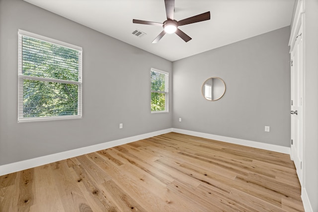 spare room with ceiling fan and light hardwood / wood-style floors