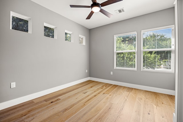 spare room featuring light hardwood / wood-style floors and ceiling fan