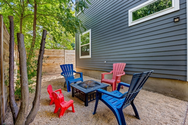 view of patio / terrace with a fire pit