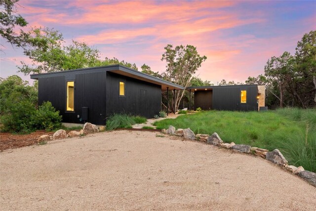 view of property exterior at dusk