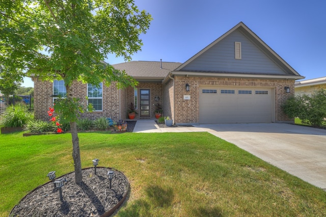 view of front of property with a garage and a front lawn