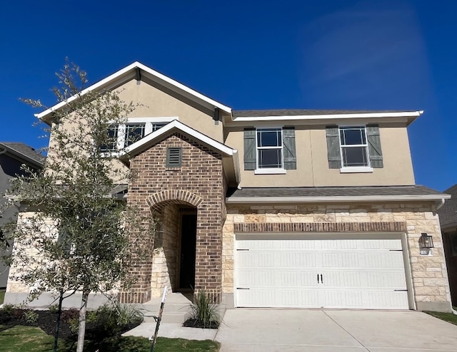 524 Raleigh Dr, Georgetown, TX 78633 - view of front of property with stone siding, stucco siding, a garage, and driveway
