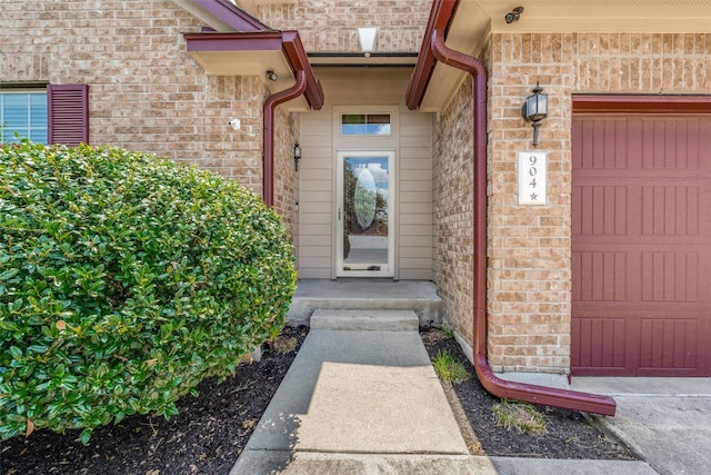 doorway to property featuring a garage