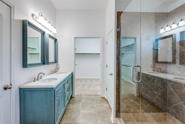 bathroom with vanity and a shower with shower door