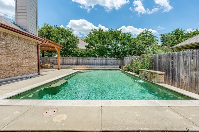 view of pool with a patio and pool water feature