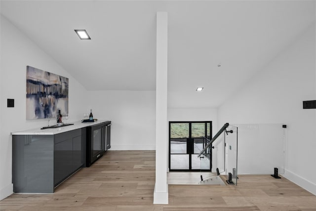 interior space featuring light hardwood / wood-style flooring and vaulted ceiling