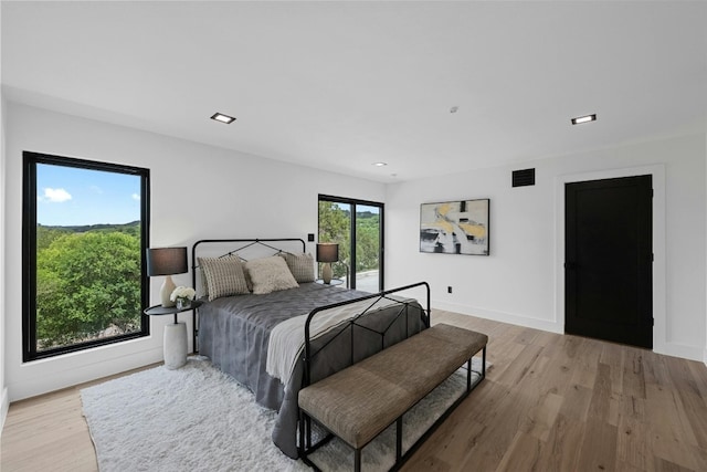 bedroom with light hardwood / wood-style flooring