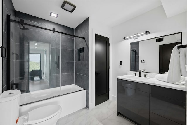 full bathroom featuring vanity, toilet, and combined bath / shower with glass door