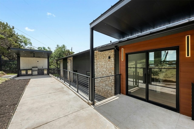 view of side of property featuring a patio