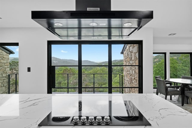 dining space featuring a mountain view and a healthy amount of sunlight