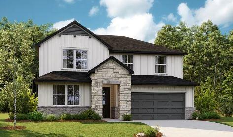 view of front of property with a garage, concrete driveway, a front lawn, and board and batten siding