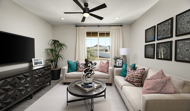 living area with ceiling fan, wood finished floors, and recessed lighting