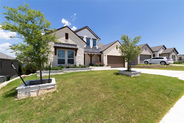 view of front of property with a garage and a front yard