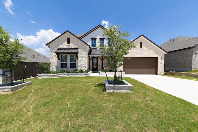 view of front of property with a front lawn and a garage