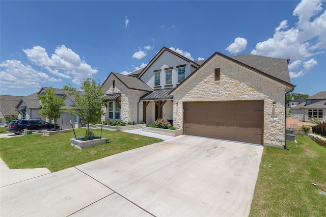 view of front of property with a garage and a front yard