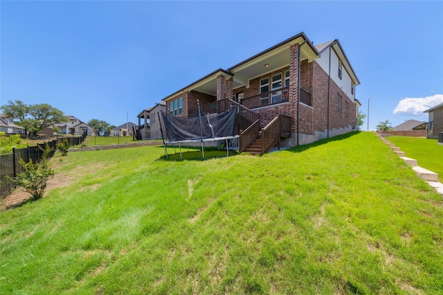 back of house with a yard