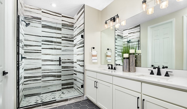 bathroom with vanity, tile patterned floors, and a shower with shower door