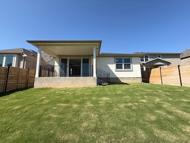 533 Raleigh Dr, Georgetown, TX 78633 - rear view of property with stucco siding