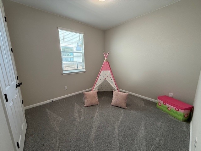 533 Raleigh Dr, Georgetown, TX 78633 - playroom with baseboards and carpet flooring