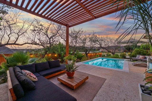 pool at dusk featuring outdoor lounge area, a patio, and a pergola