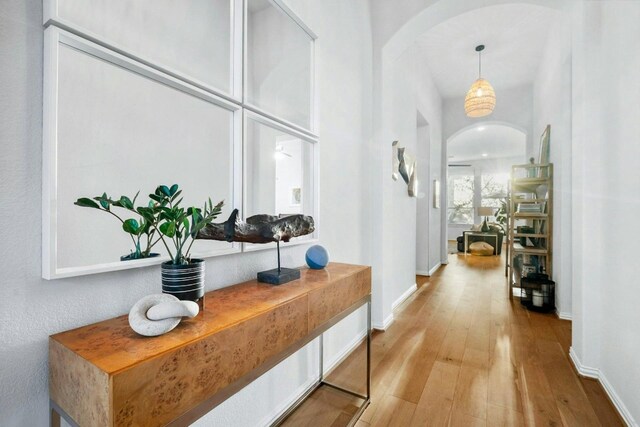 corridor with light hardwood / wood-style flooring