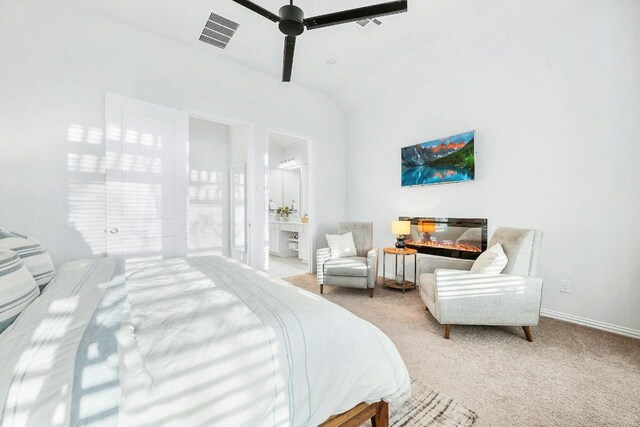 carpeted bedroom with connected bathroom and ceiling fan