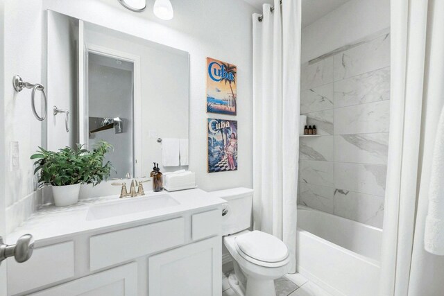 full bathroom featuring tile patterned flooring, vanity, shower / bath combo, and toilet