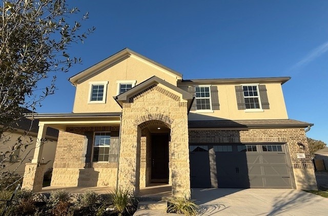 540 Raleigh Dr, Georgetown, TX 78633 - traditional home featuring brick siding, an attached garage, concrete driveway, and stucco siding